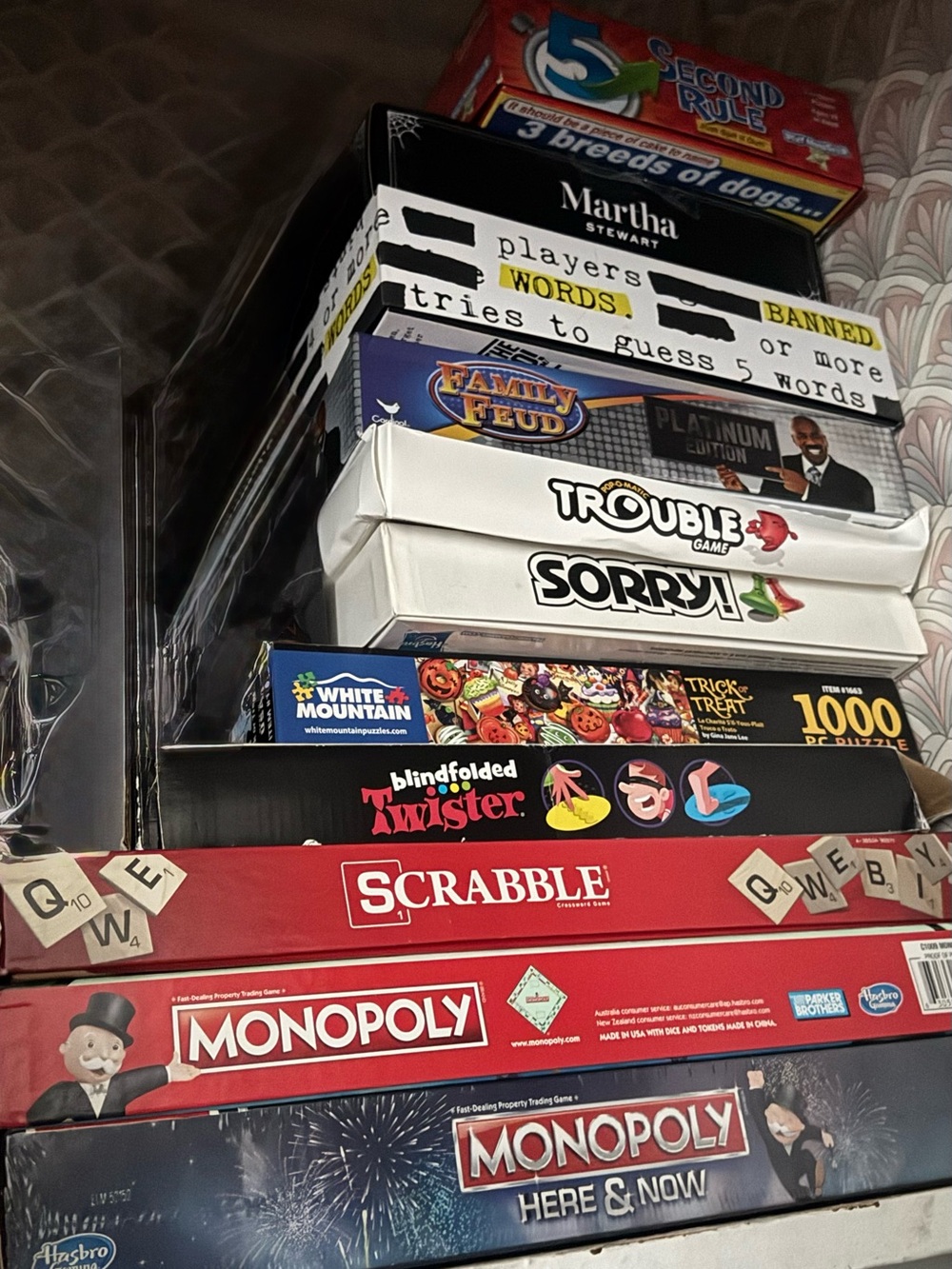 Hasbro Stack of Board Games with Red Scrabble and Monopoly Boxes